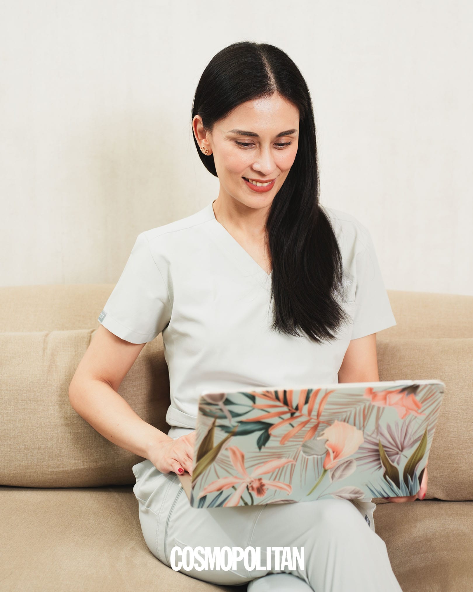 Dr. Gaile Robredo-Vitas on her laptop